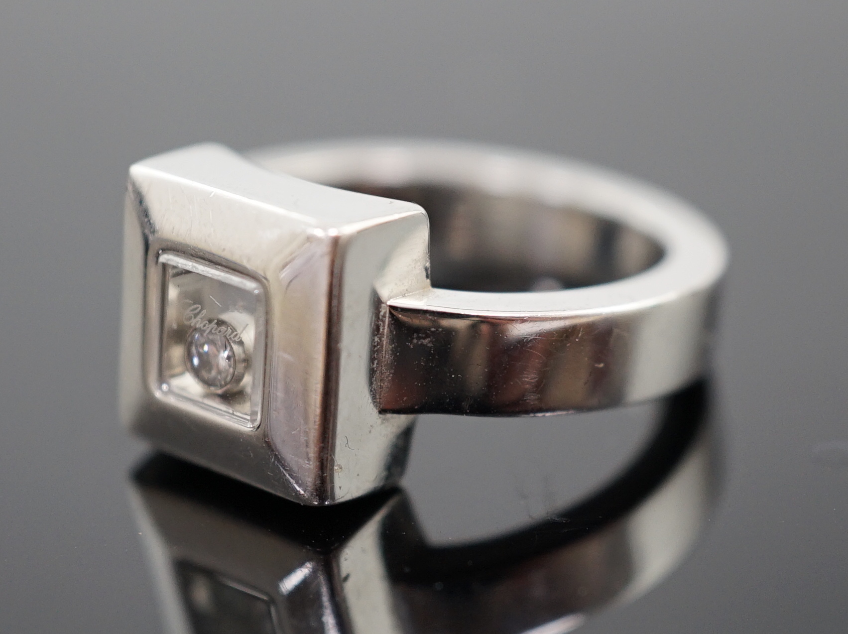 A modern Chopard 18ct white gold 'Happy Floating' diamond ring